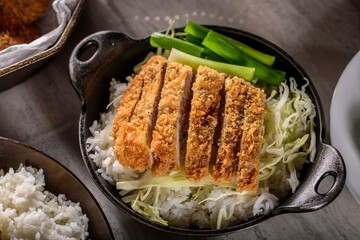 Savory Delights: Close-Up of Deep-Fried Orange Chicken Served on a Bed of Steamed White Rice, Captured in 4K Resolution