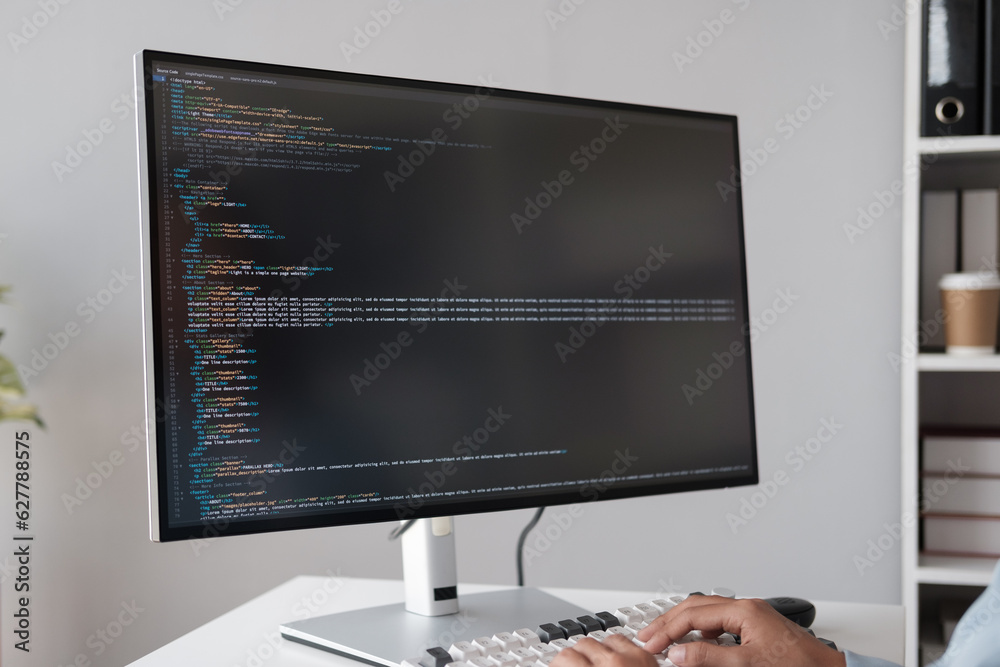 Poster Close up view of programmer making software developer programming code with desktop computer in the office room.