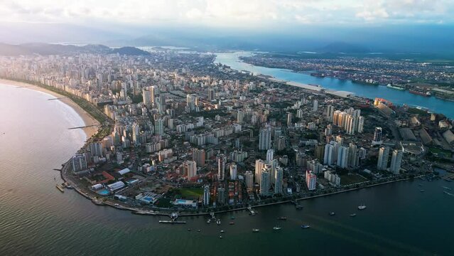 Aerial view of a port city on an island. Boats and ships standing at sea around the city of Santos, Brazil. Aerial view of Santos, S&atilde;o Paulo, Brazil