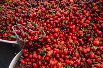 Сherries sale in the traditional farm Turkish market, a counter filled with fresh fruits
