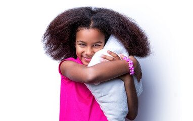 Smiling kid girl holding cushion. Smile little african american girl hold kissen. Morning little girl - pillow, cushion, kissen. Children girl holding a pillow on a white background