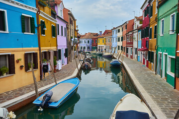 Fototapeta na wymiar Colorful houses on the canal in Burano island, Venice, Italy.