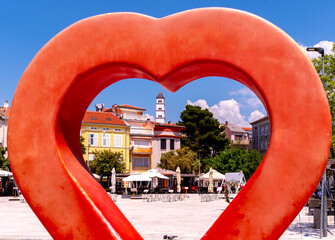 View of the scenic promenade with restaurants on a sunny day in Crikvenica, Croatia