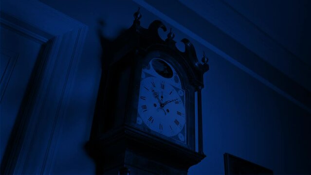 Spooky Shadows Moving Over Grandfather Clock At Night