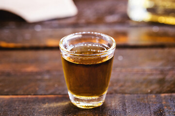 Bottle of brazilian traditional cachaça. Used to make caipirinha drink. Alcohol distilled drink on barrel bottom, personal reserve. Export type drink from Brazil.
