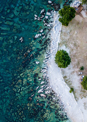 Topdown aerial picture of a rocky beach on Adriatic Sea.