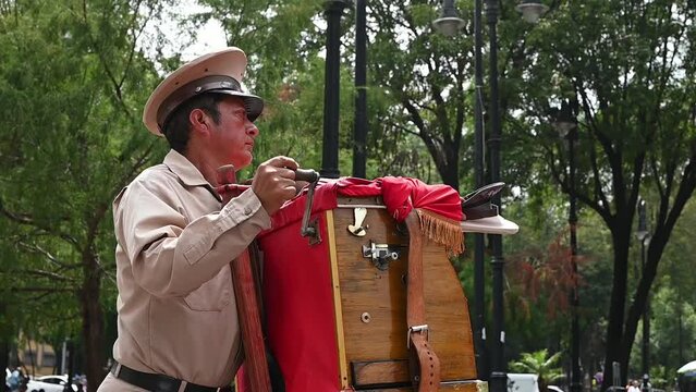 Man playing wooden organ in Mexico City