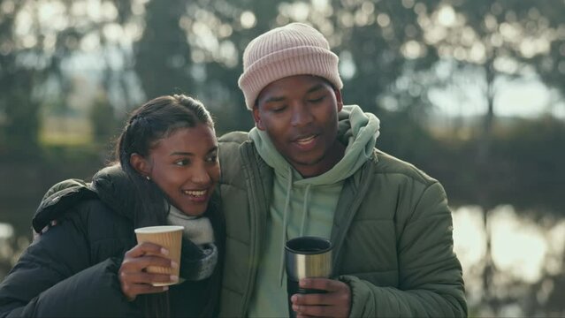 Camping, coffee and couple hug in conversation for bonding, quality time and relaxing in morning. Travel, nature and happy black man and woman with tea drinking on adventure, holiday and vacation