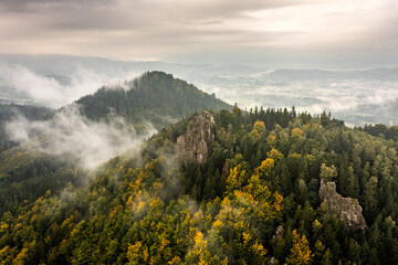 Misty mountains in Autumn - aerial shot of Sokolik in Rudawy Janowickie mountains, Poland. - obrazy, fototapety, plakaty