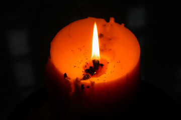 Close up view of the candles cutting through the darkness.