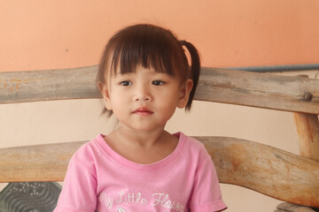 Girl in pink shirt with her pose