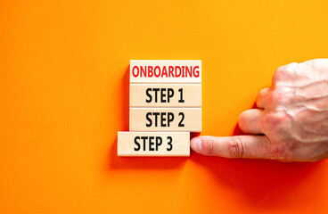 Time to step 3 onboarding symbol. Concept words Onboarding step 3 on wooden block. Businessman hand. Beautiful orange table orange background. Business success step 3 onboarding concept. Copy space.