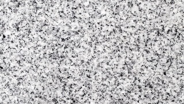 Background marble crumb black and white surface moving sideways, close-up macro, top view
