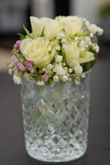 Elegant wedding boutonniere with fresh flowers. Soft focus.