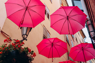 Famous pink umbrellas decorating the central streets of Grasse