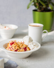 morning breakfast berry crumble a cup of coffee light gray background indoor flower morning light