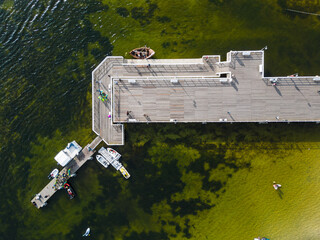 Obraz premium molo pier of Polish village Jastarnia, water of Baltic Sea, aerial drone view