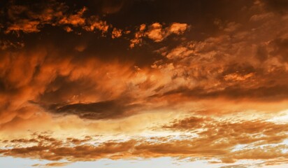 Dramatic sunset sky with orange and red clouds. Dramatic sky.