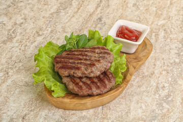 Grilled beef burger cutlet with sauce