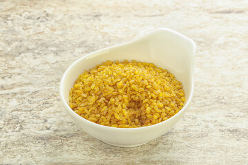 Raw bulgur in the bowl