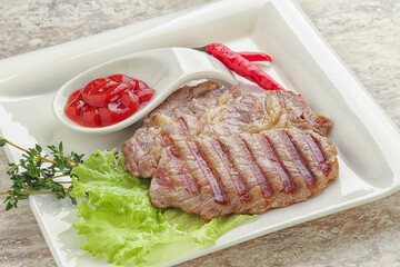 Grilled pork neck steak with ketchup