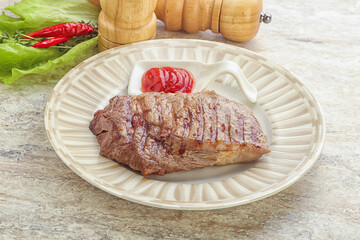 Grilled rib-eye steak beef meat