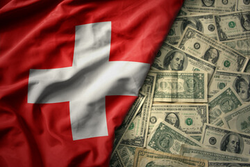 colorful waving national flag of switzerland on a american dollar money background. finance concept