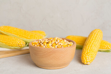 Dry corn with fresh cobs on wooden table