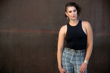 Fototapeta premium Serious portrait of a stylish woman with interesting hair style, lgbtq lifestyle 