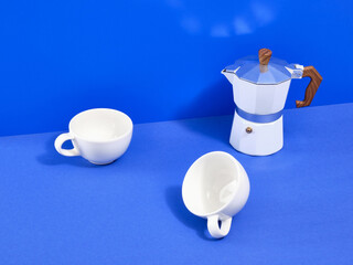 Coffee break in office. Italian metallic coffee maker and cups.