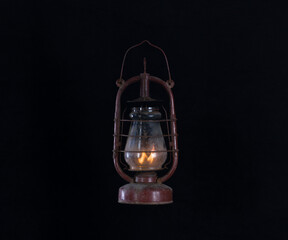 rusty dirty kerosene lamp isolated on black background