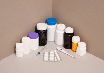 Treatment of various diseases. Health care. Pills and capsules, thermometer, syringe.