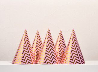 Fototapeta premium Some shiny, colorful birthday party gift hats. Celebration mood.
