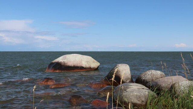 Hindens rev at V&auml;nern. The biggest lake in Sweden. Large wet rocks. Windy outside this summer day. Near Lidk&ouml;ping.