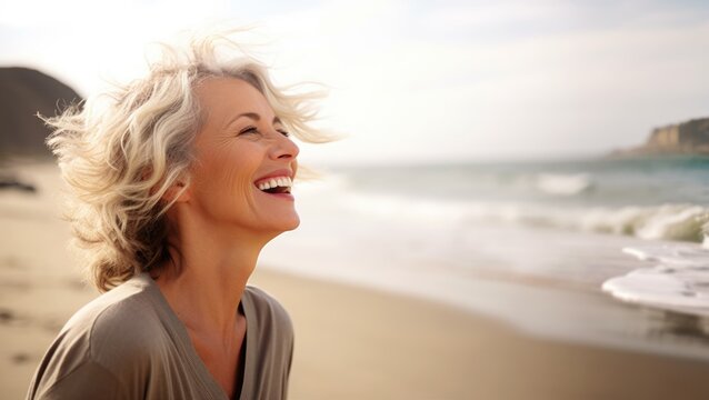 Laughing Attractive Mature Senior Woman Looking Away In The Coast