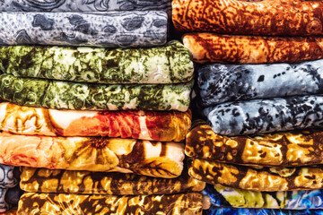 Colorful patterned cloth for sale at a market in Srinagar.