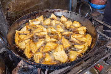 Frying somosas at a market in Srinagar.