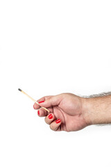 
Male hand with red painted fingernails holding burnt out matchstick, isolated on white background. Concept of difference and LGBT