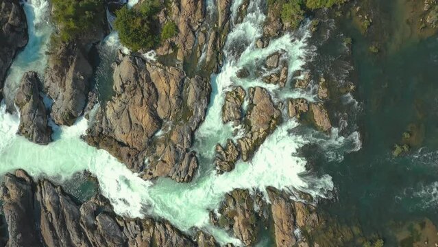 Top down aerial cinematic travelling of Li Phi Somphamit Waterfalls. Tourist travel destination of the 4000 islands, Mekong, Laos.