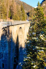 Papier Peint photo Viaduc de Landwasser View of Wiesen Viaduct, Rhaetian railway, Graubunden in Switzerland at winter