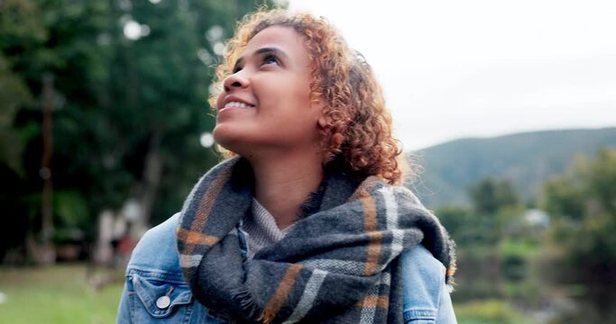 Hiking, looking up at view and woman on adventure in nature for camping on a walk. Healthy person, forest and vacation with peace outdoor on holiday in woods with calm smile and freedom in travel