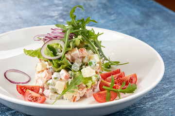 russian salad on the white plate