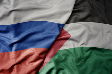 big waving realistic national colorful flag of russia and national flag of palestine . - obrazy, fototapety, plakaty