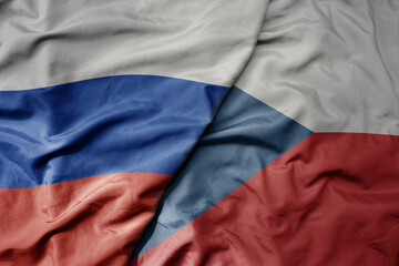 big waving realistic national colorful flag of russia and national flag of czech republic .