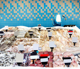  fresh fish seafood in supermarket.choosing a dairy products at supermarket.