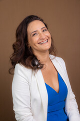 Portrait of coaching woman, sitting, looking at camera. Confidence, encouragement and motivation concept.