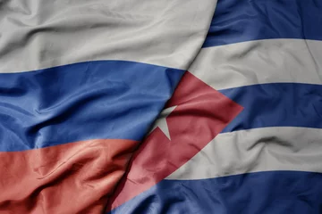 Photo sur Plexiglas Havana big waving realistic national colorful flag of russia and national flag of cuba .