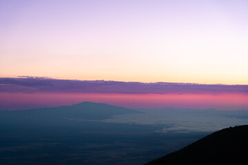 Beautiful sky after sunset, Pu'u Kalepeamoa, Mauna Kea, Big Island Hawaii. Hualālai volcano.