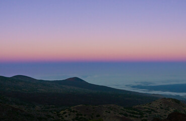 Beautiful sky after sunset, Pu'u Kalepeamoa, Mauna Kea, Big Island Hawaii. The Belt of Venus (also called Venus's Girdle, the antitwilight arch, or antitwilight), pinkish glow.  Earth's shadow