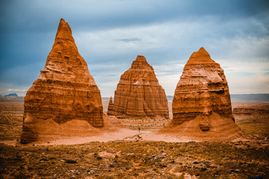 Tourist standing at Temple of the Moon, Cathedral Valley, Capitol Reef National Park, Utah, Western United States, USA - Powered by Adobe